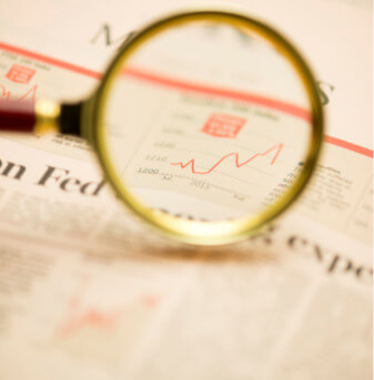 Magnifying glass on stock market data
